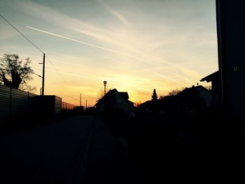 Road in city at sunset