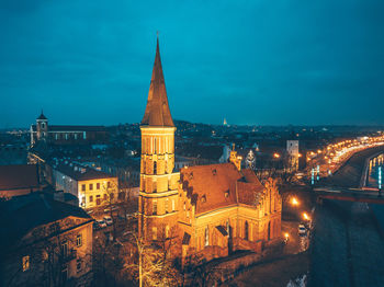 High angle view of city lit up at night