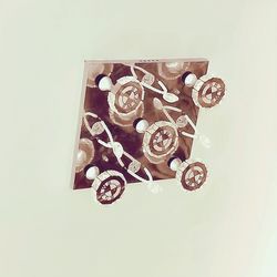 High angle view of electric lamp against white background