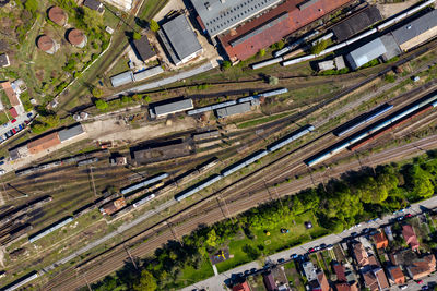 High angle view of railroad tracks amidst buildings in city