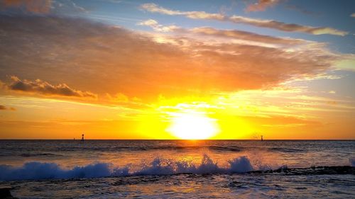 Scenic view of sea at sunset