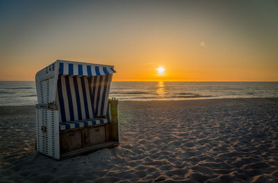 Scenic view of beach against sky during sunset