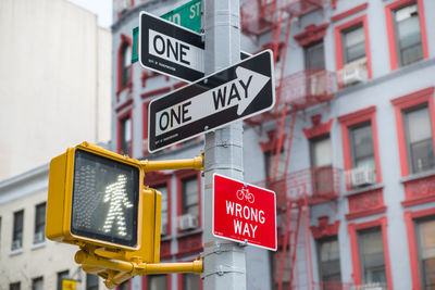 Information sign on pole in city