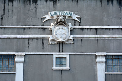Close-up of clock on building