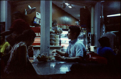 Side view of people working in restaurant