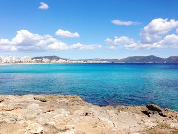 Scenic view of sea against cloudy sky