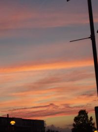 Low angle view of dramatic sky during sunset