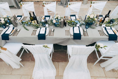 High angle view chairs and table at restaurant