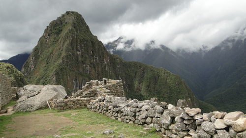 View of stone wall on moss covered mountain