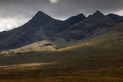 Scenic view of mountains against the moody sky