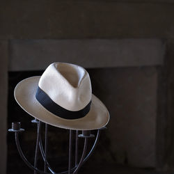 Close-up of panama hat on candlestick holder