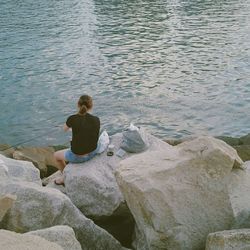 Young woman standing on rock