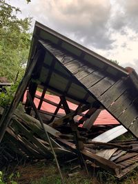 Low angle view of abandoned building against sky