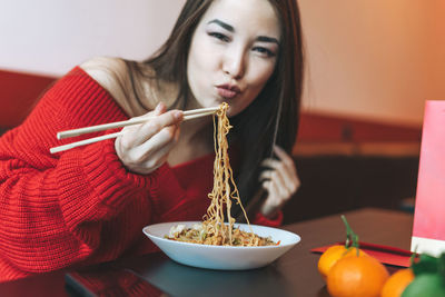 Portrait of woman holding food