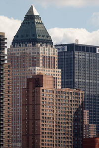 Low angle view of skyscrapers against sky