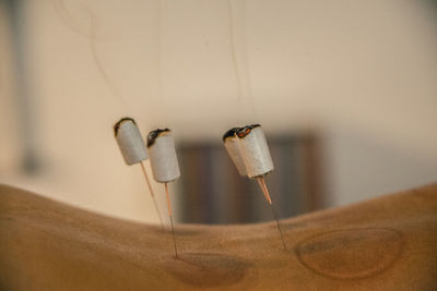 Close-up of clothespins on table at home