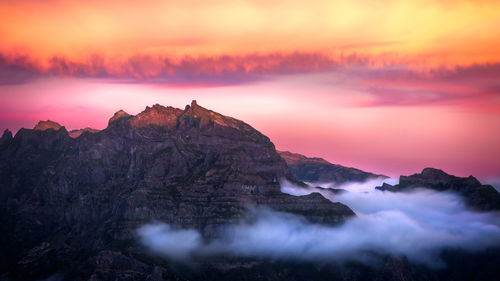 Scenic view of mountain against sky during sunset