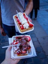 Midsection of person holding food