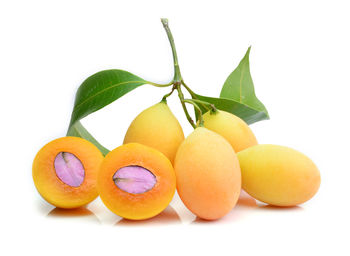 Close-up of oranges against white background