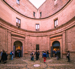 Group of people in front of historical building