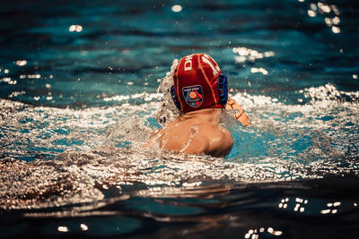 Man swimming in pool