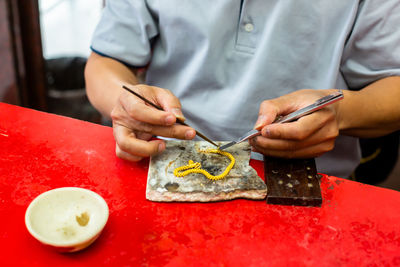 Midsection of man preparing food