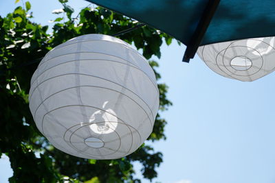 Low angle view of decoration hanging against sky