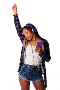 Portrait of young woman using mobile phone