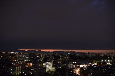 Illuminated cityscape at night