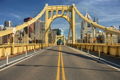 View of bridge in city against sky