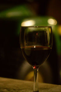 Close-up of wineglass on table