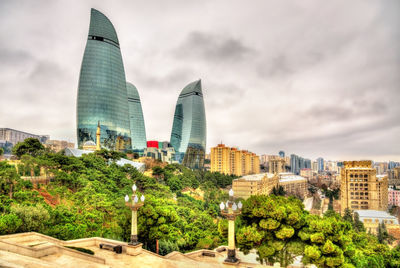 Modern buildings in city against sky