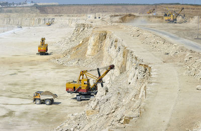 Excavator and dumper truck at mining site