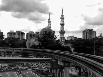 View of city against cloudy sky