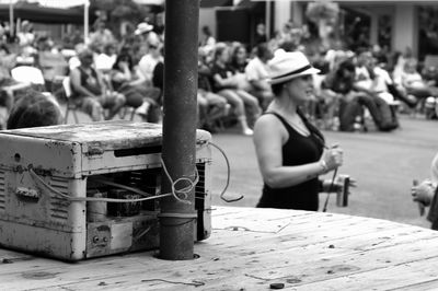 Rear view of people sitting outdoors