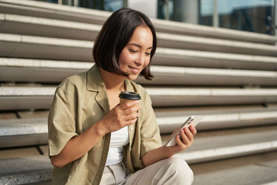 Young woman using mobile phone