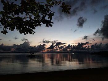 Scenic view of lake against sky at sunset