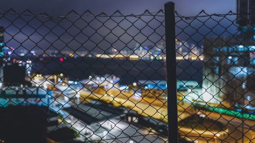 Chainlink fence seen through chainlink fence