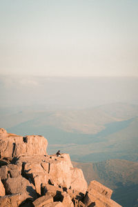 Rock formations on landscape against sky