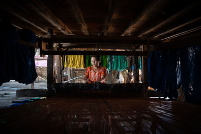 Portrait of woman sitting on stage