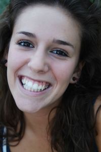 Close-up portrait of a smiling young woman