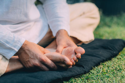 Hands of reiki therapist doing self-treatment. energy healing concept