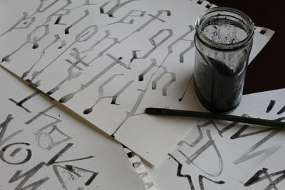 High angle view of text on paper at table