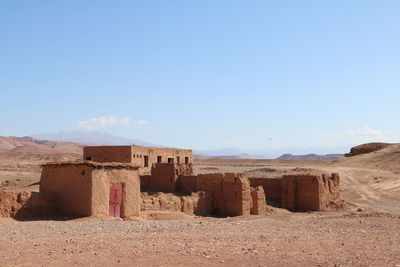 Built structure on land against sky