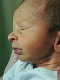 High angle close-up of newborn baby girl