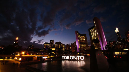 Reflection of illuminated buildings in water