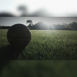 Ball on field against sky