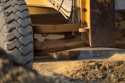 Road grader working at construction site for maintenance and construction of dirts and gravel road.