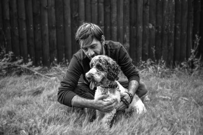 Man with dog on field