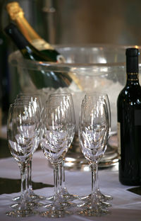 Close-up of wine glasses on table